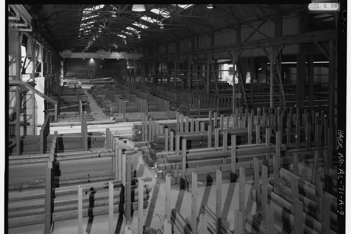 Hot rolled steel angles and bars in a fabrication shop storage bay