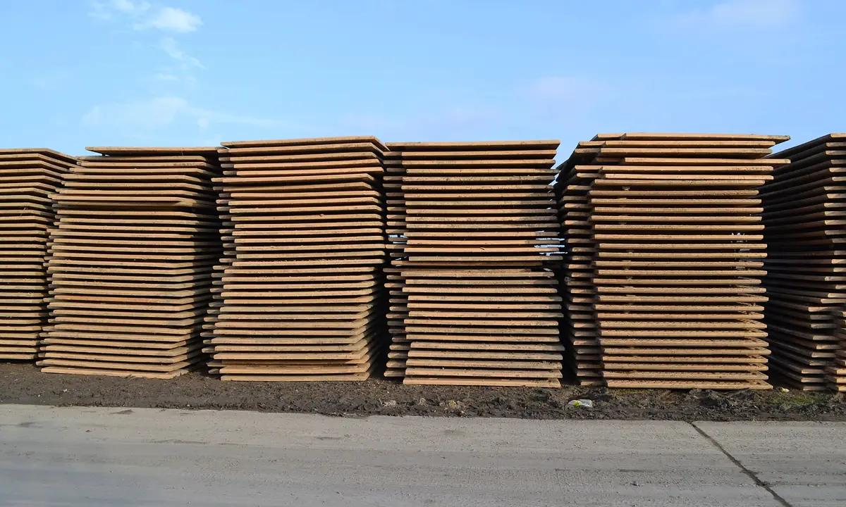 Stacks of industrial steel plates in a yard